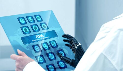 Robotic hand interacting with RPA touchscreen tablet