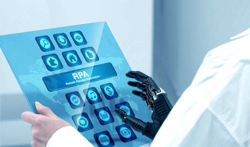 Robotic hand interacting with RPA touchscreen tablet