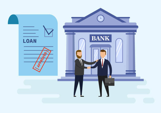 Two businessmen shaking hands after loan approval
